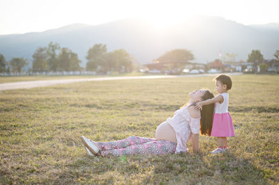 Side view of women on field