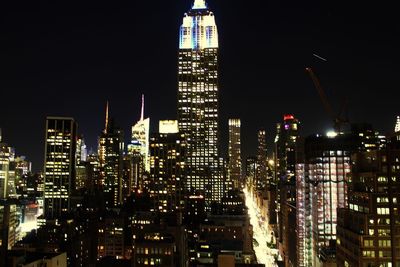 View of skyscrapers lit up at night