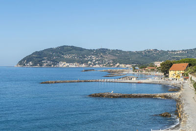 Scenic view of sea against clear blue sky