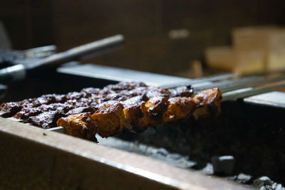 Close-up of meat on barbecue grill