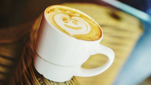 Close-up of cappuccino on table