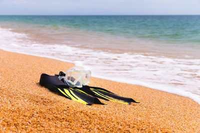 Rear view of woman standing on beach