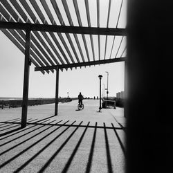 View of pier on beach against clear sky