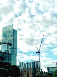 Low angle view of buildings in city against sky