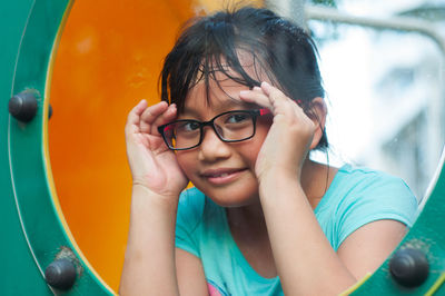 Close-up of girl playing on ground