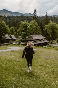 Full length of woman standing on field