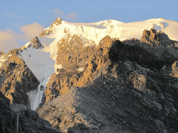 Panoramic view of snowcapped mountains against sky