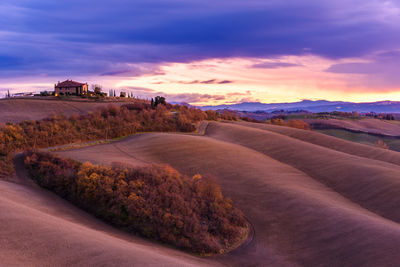 Scenic view of landscape against sky during sunset