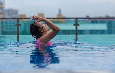 Woman swimming in pool