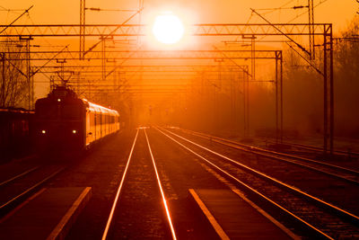 Railroad tracks at sunrise