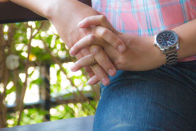 Close-up of couple holding hands