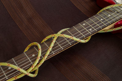 Close-up of guitar on table