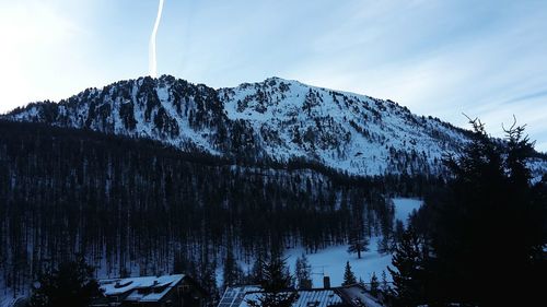 View of snow covered mountain range against the sky