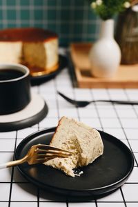 Close-up of cake slice in plate on table