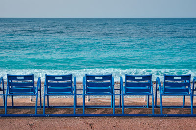 Famous blue chairs on beach of nice, france