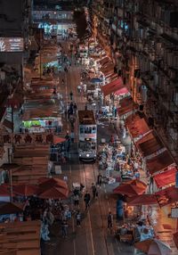 High angle view of people in market at night