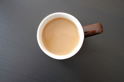 High angle view of coffee cup on table