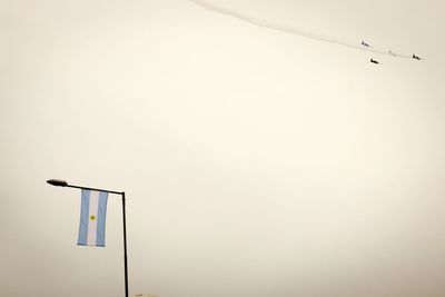 Fighter planes over argentinean flag