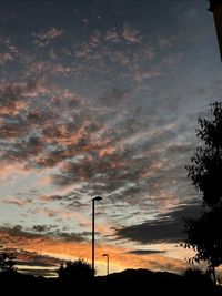 Low angle view of silhouette trees against sky during sunset