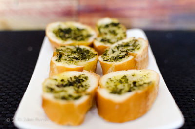 Close-up of garlic bread in plate on table