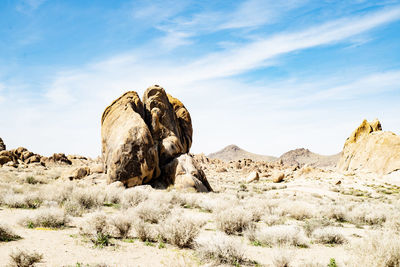 Rock formations in desert against sky