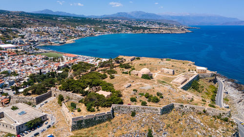 High angle view of townscape by sea