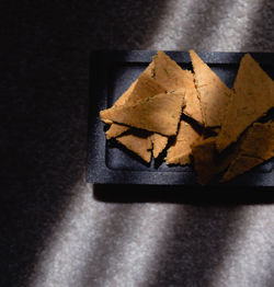 High angle view of breakfast on table against black background