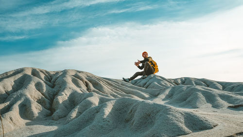 Man sitting on rock