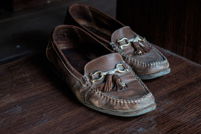 Close-up of shoes on table