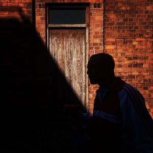 Man standing against door