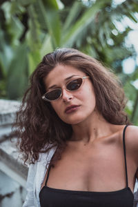 Portrait of young woman wearing sunglasses