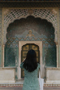 Rear view of woman standing in church