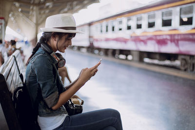 Full length of man using mobile phone