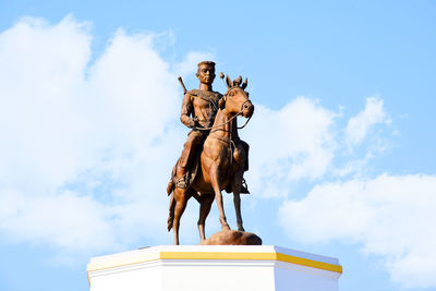 Low angle view of statue against sky