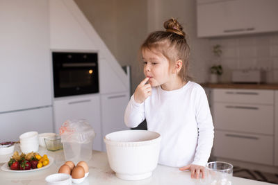 Young woman drinking coffee at home