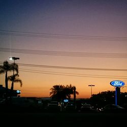 Cars on road at sunset