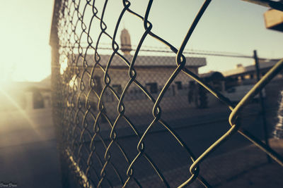 Close-up of chainlink fence against clear sky