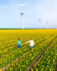 Scenic view of oilseed rape field against sky