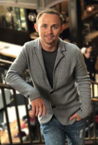 Portrait of smiling man standing outdoors