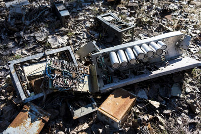 High angle view of old abandoned car on field