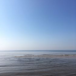 Scenic view of calm sea against clear sky