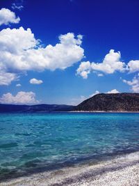 Scenic view of sea against blue sky