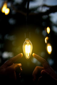 Close-up of illuminated light bulb