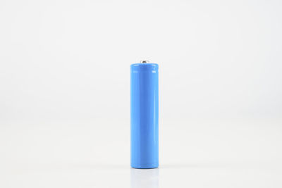 Close-up of blue container against white background