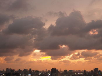 Dramatic sky over city during sunset