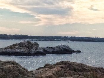 Scenic view of sea against cloudy sky