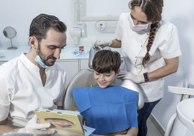 Male friends working at clinic