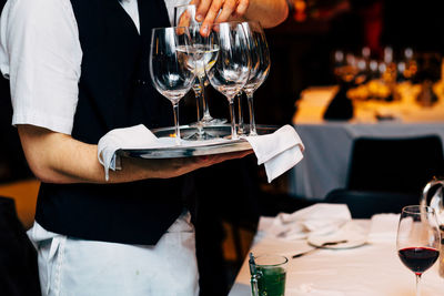 Pouring and serving champagne in a luxury social events like weddings and party.