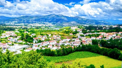 High angle view of houses and buildings against sky