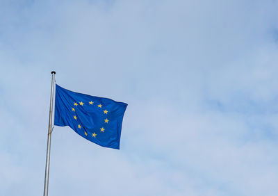 Low angle view of flag against sky